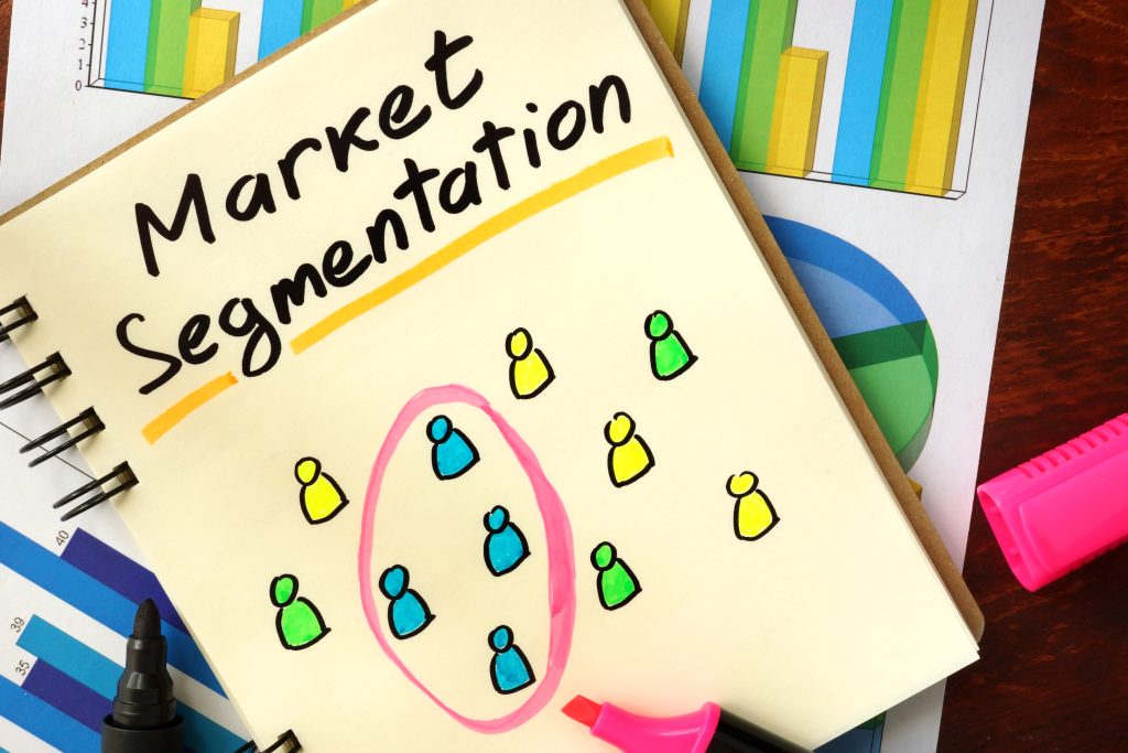 Notebook page titled 'Market Segmentation' with a pink circle around colorful group icons representing segments shift in a chart-style diagram